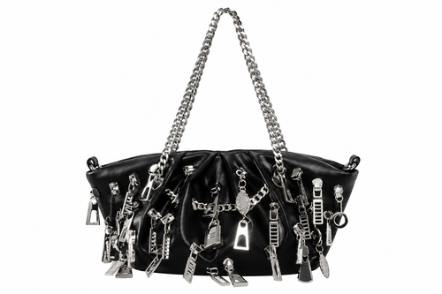 A black leather shoulder bag adorned with numerous silver zipper pulls, charms, and chain details, featuring a silver chain strap, set against a plain white background.